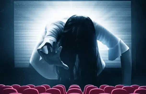 A group of people at a Reel Creatives event watching a presentation.